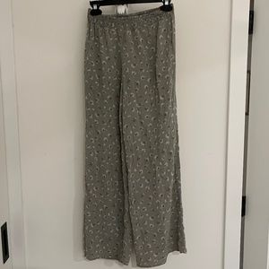 Flowy green pants with white flowers